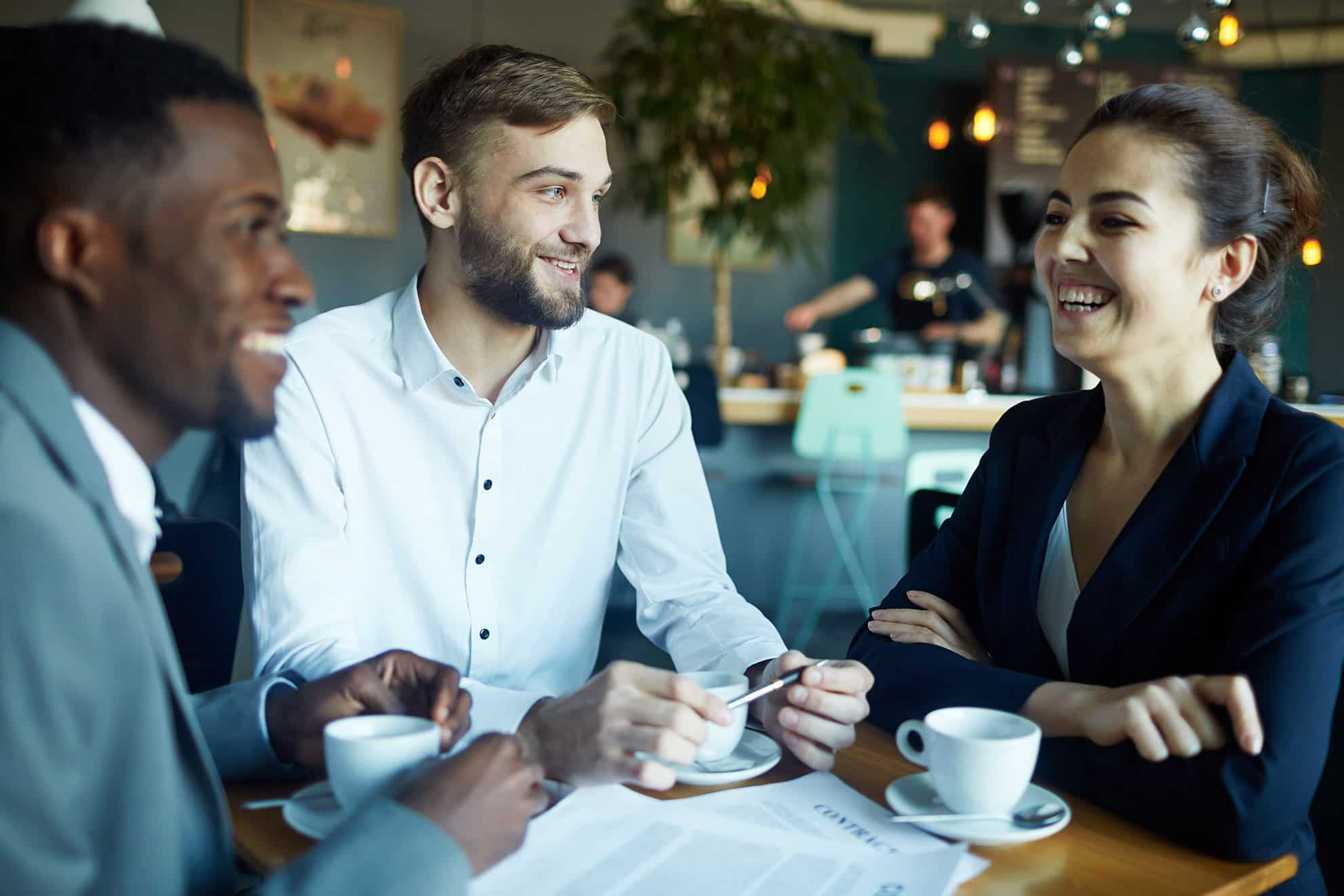 Business colleagues talking in a coffee shop