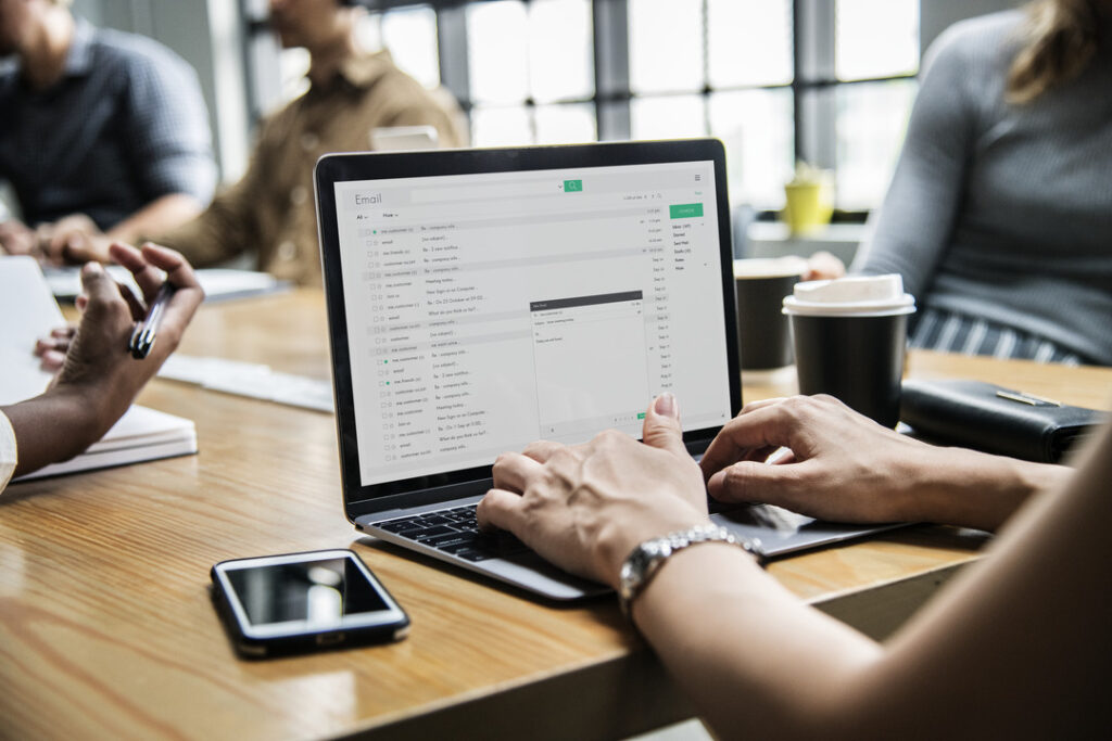 Woman practices email security practices while checking messages